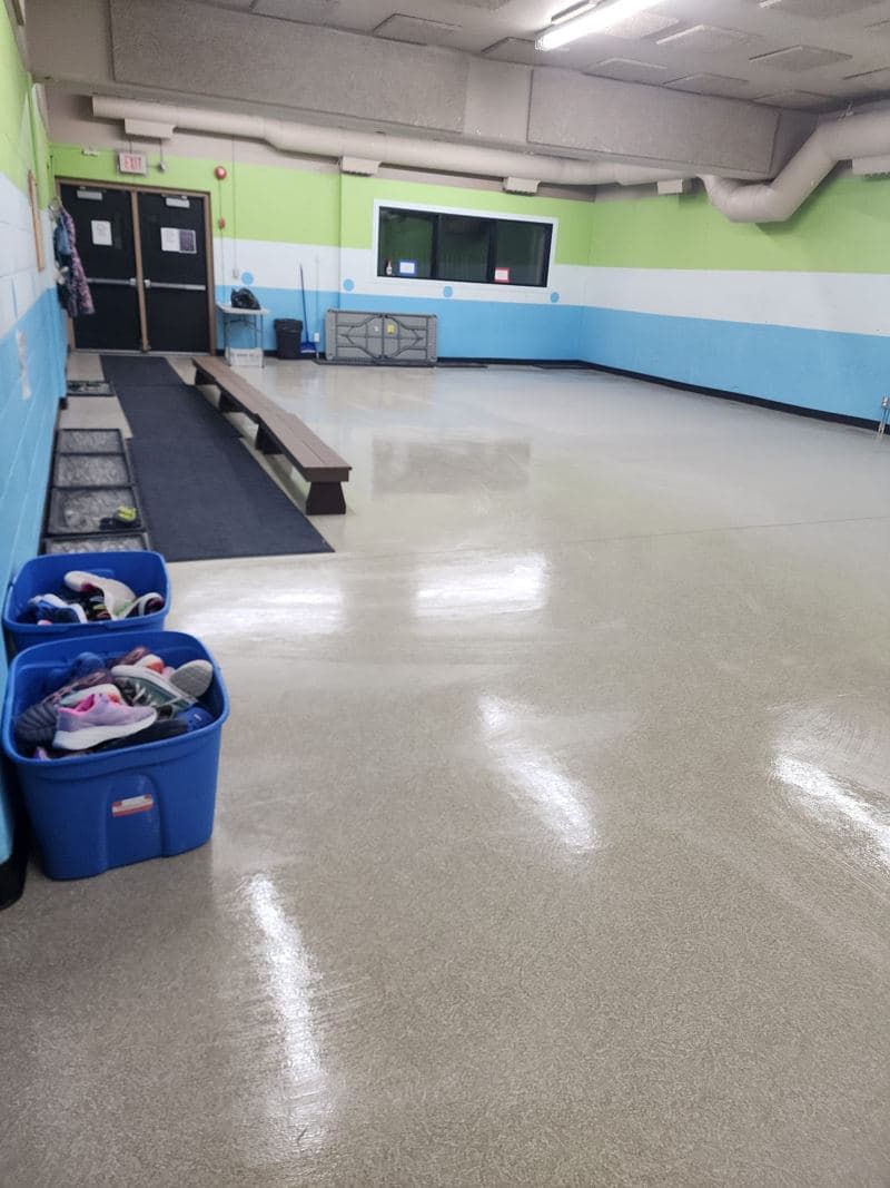 Community room with a glossy, freshly cleaned vinyl floor