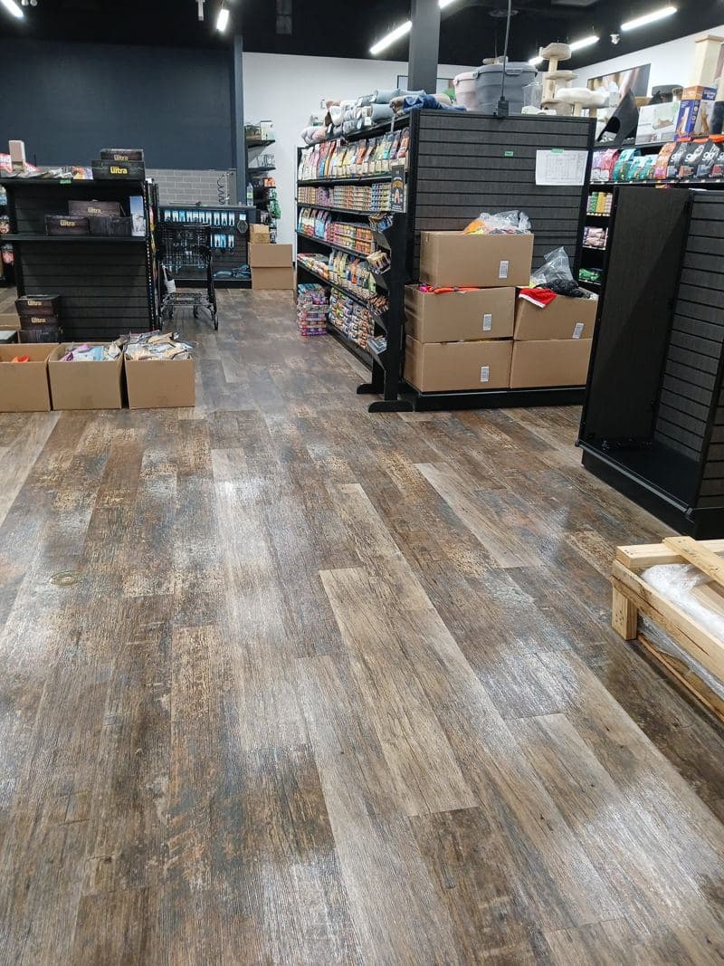 Retail stockroom with a swept and mopped wood-effect floor